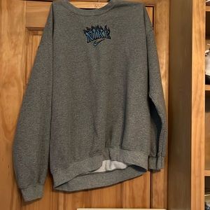 Giladan crewneck with hand sewn Nike flame symbol